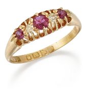 AN 18 CARAT GOLD RUBY AND DIAMOND RING