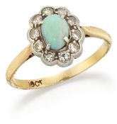 AN OPAL AND DIAMOND CLUSTER RING