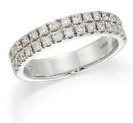 AN 18 CARAT WHITE GOLD DIAMOND HALF HOOP RING