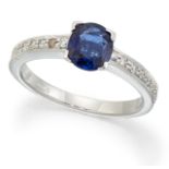 AN 18 CARAT WHITE GOLD SAPPHIRE AND DIAMOND RING