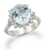 AN 18 CARAT WHITE GOLD AQUAMARINE AND DIAMOND CLUSTER RING