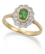 AN 18 CARAT GOLD TSAVORITE GARNET AND DIAMOND CLUSTER RING