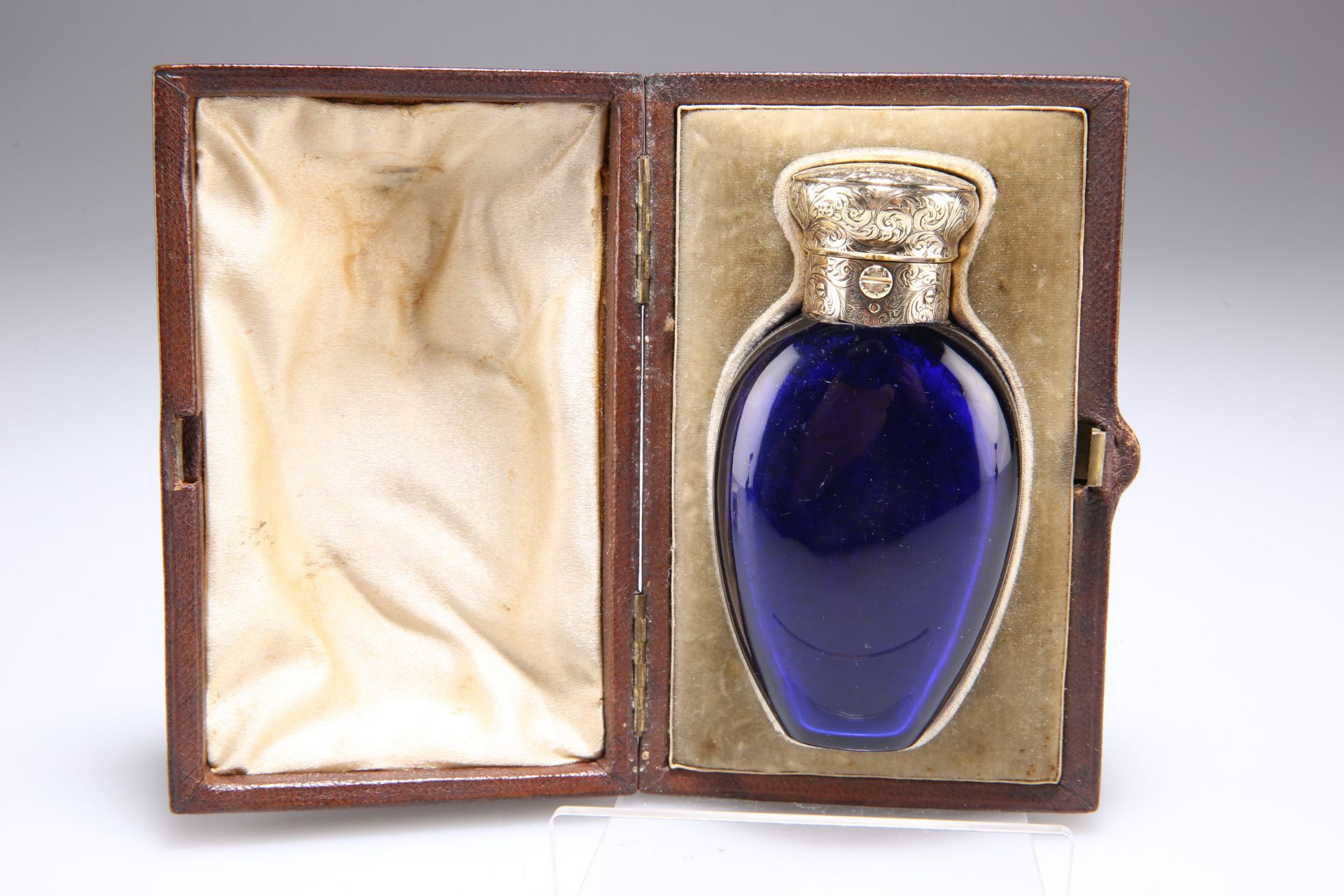 A VICTORIAN GOLD-MOUNTED BLUE-GLASS SCENT BOTTLE