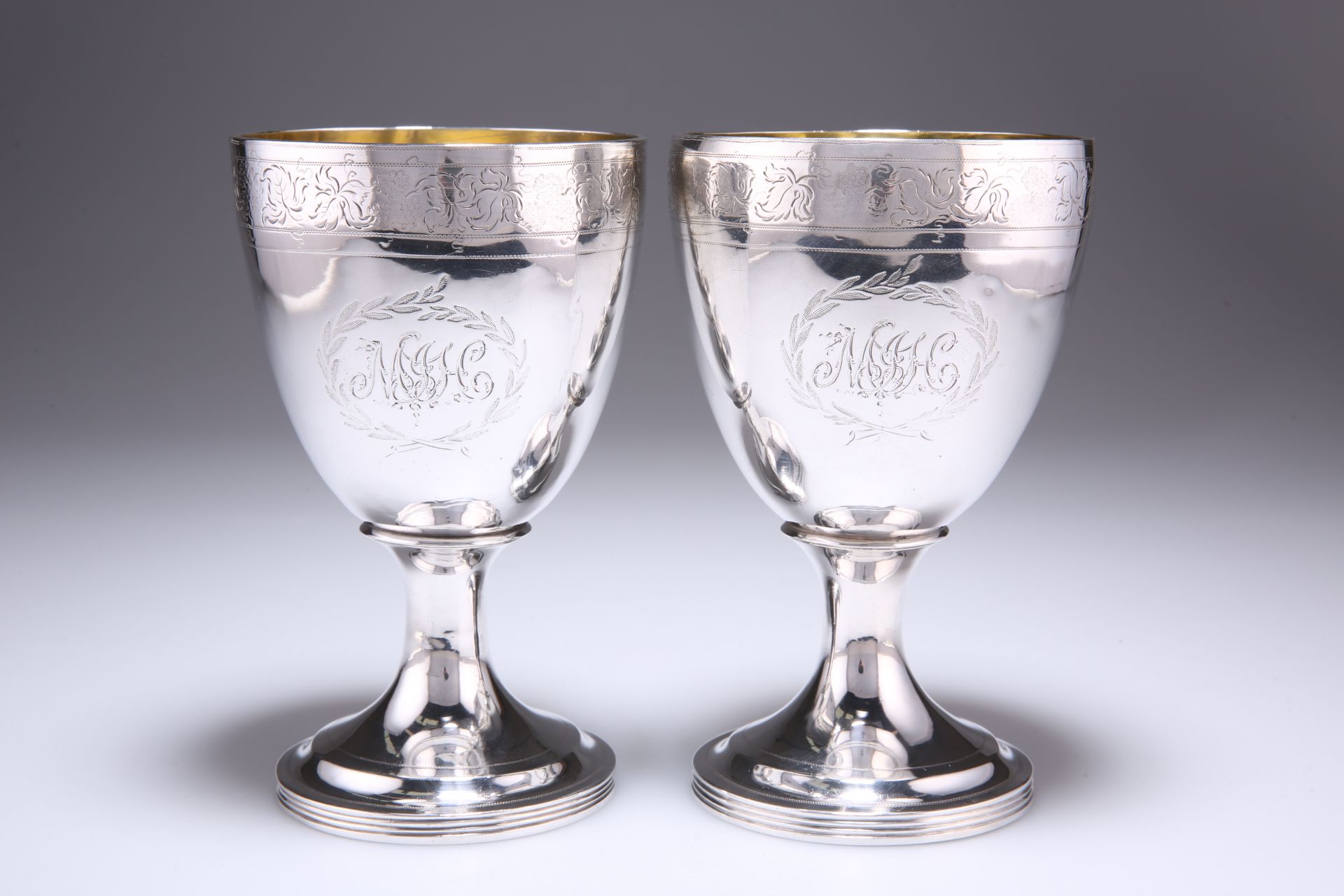 A PAIR OF PROVINCIAL GEORGE III SILVER GOBLETS