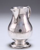 A GEORGE II SILVER PITCHER CREAM JUG