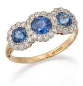 A SAPPHIRE AND DIAMOND TRIPLE CLUSTER RING