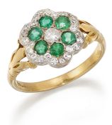 AN EMERALD AND DIAMOND CLUSTER RING