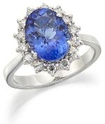 A TANZANITE AND DIAMOND CLUSTER RING