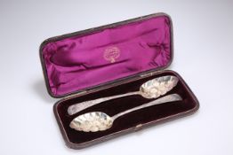 A NEAR PAIR OF GEORGE III SILVER BERRY SPOONS