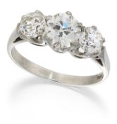 A PLATINUM THREE STONE DIAMOND RING