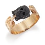 AN UNUSUAL CARVED HORN MEMENTO MORI RING