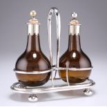A PAIR OF 19TH CENTURY SILVER-PLATE MOUNTED AMBER GLASS OIL BOTTLES