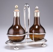 A PAIR OF 19TH CENTURY SILVER-PLATE MOUNTED AMBER GLASS OIL BOTTLES