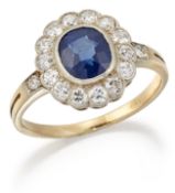 A SAPPHIRE AND DIAMOND CLUSTER RING