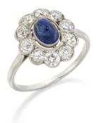 A SAPPHIRE AND DIAMOND CLUSTER RING