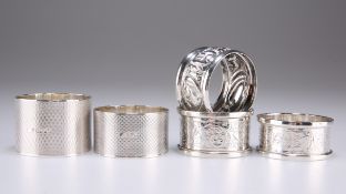 FOUR SILVER NAPKIN RINGS