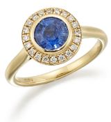 AN 18 CARAT GOLD SAPPHIRE AND DIAMOND CLUSTER RING