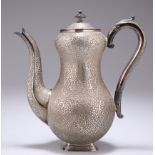 AN INDIAN SILVER COFFEE POT