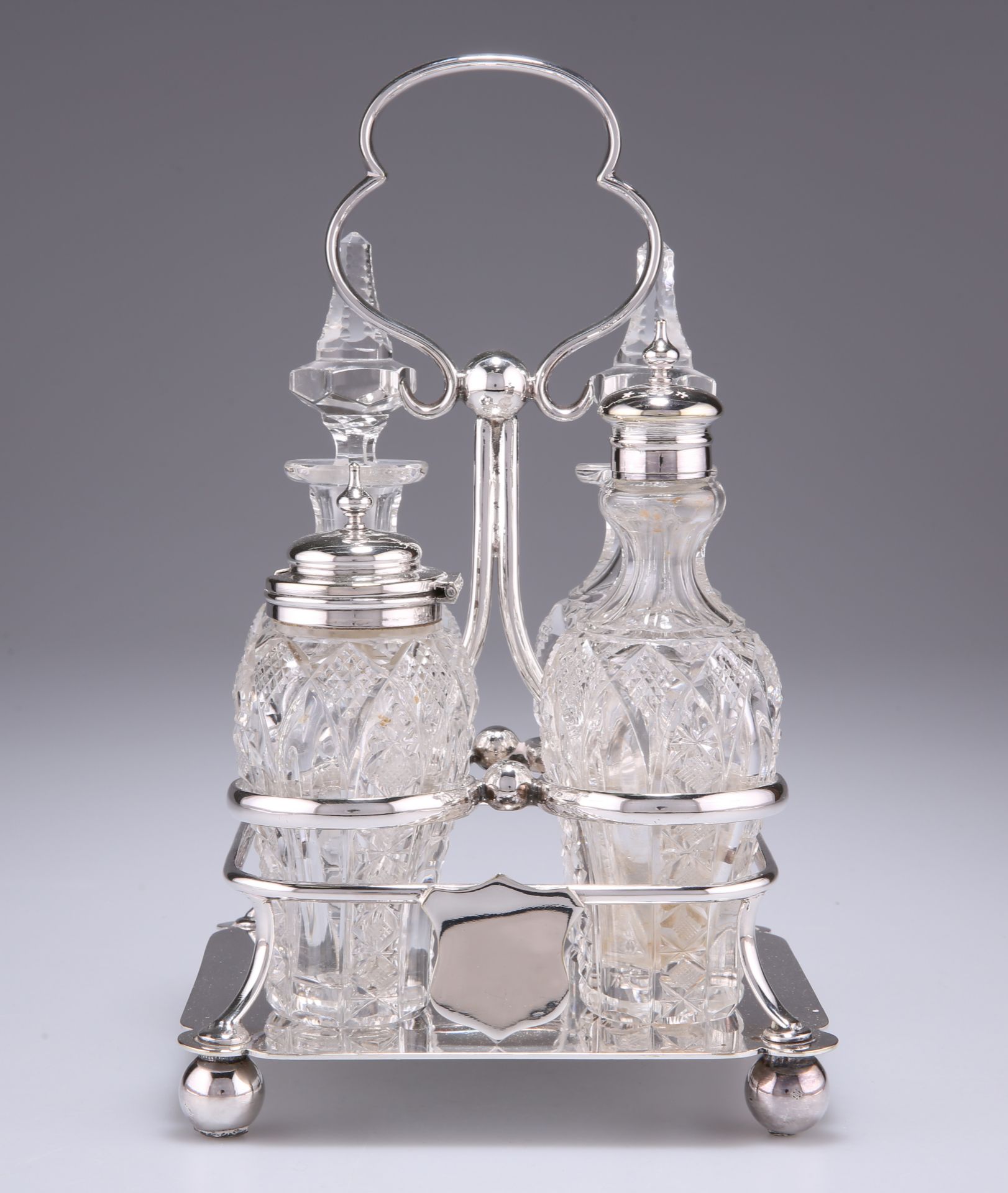 A LATE VICTORIAN ELECTROPLATED FOUR-BOTTLE CRUET SET