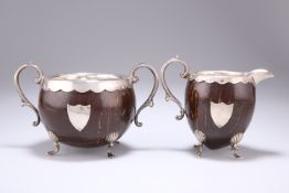 AN EDWARDIAN SILVER-MOUNTED COCONUT CREAM JUG AND SUGAR BOWL