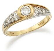 AN 18 CARAT GOLD DIAMOND RING