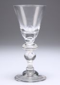 A HEAVY BALUSTER WINE GLASS