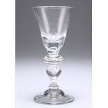 A HEAVY BALUSTER WINE GLASS