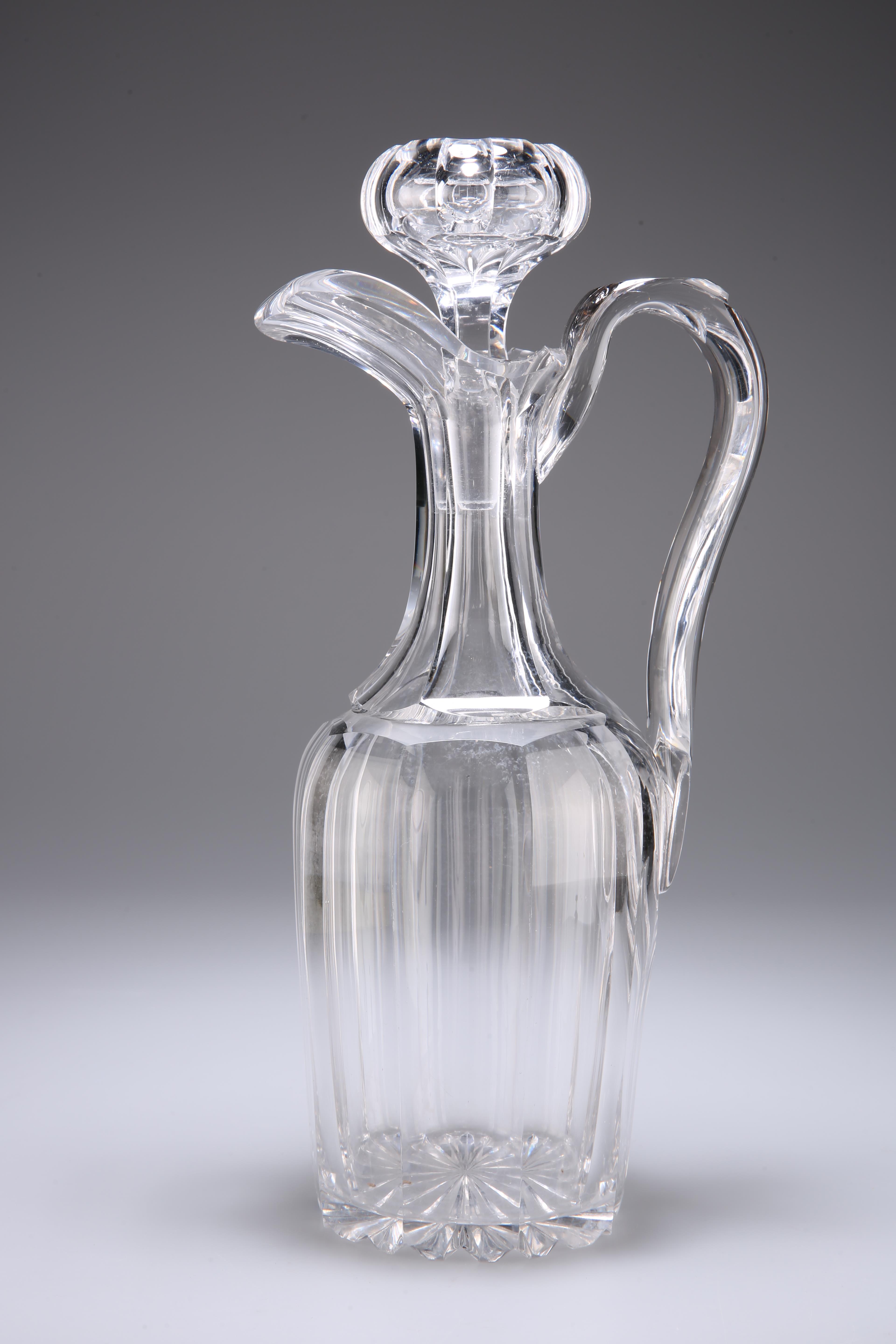 A HEAVY CUT-GLASS DECANTER, POSSIBLY BACCARAT