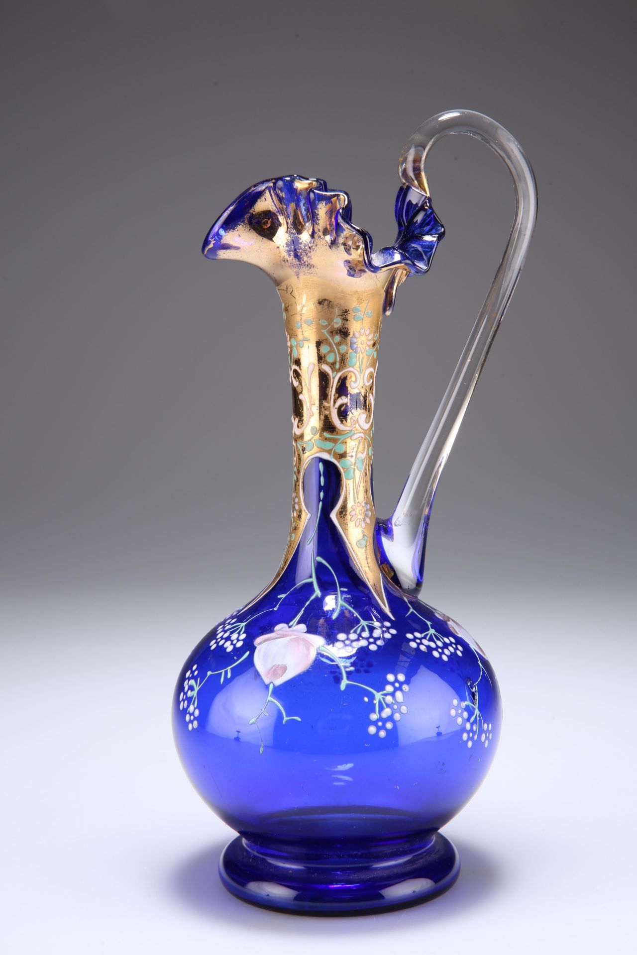 A VENETIAN BLUE GLASS EWER