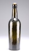 A PLANISHED GREEN GLASS WINE BOTTLE