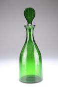 AN ENGLISH GREEN GLASS DECANTER, of mallet form, lozenge-shaped stopper. 33.5cm high Provenance: The