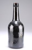 A BROWN GLASS BOTTLE,