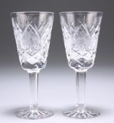 A PAIR OF WATERFORD SHERRY OR PORT GLASSES, with extensive cutting to the bodies, signed. 13cm