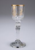 AN EARLY 19TH CENTURY GILDED LIQUEUR GLASS