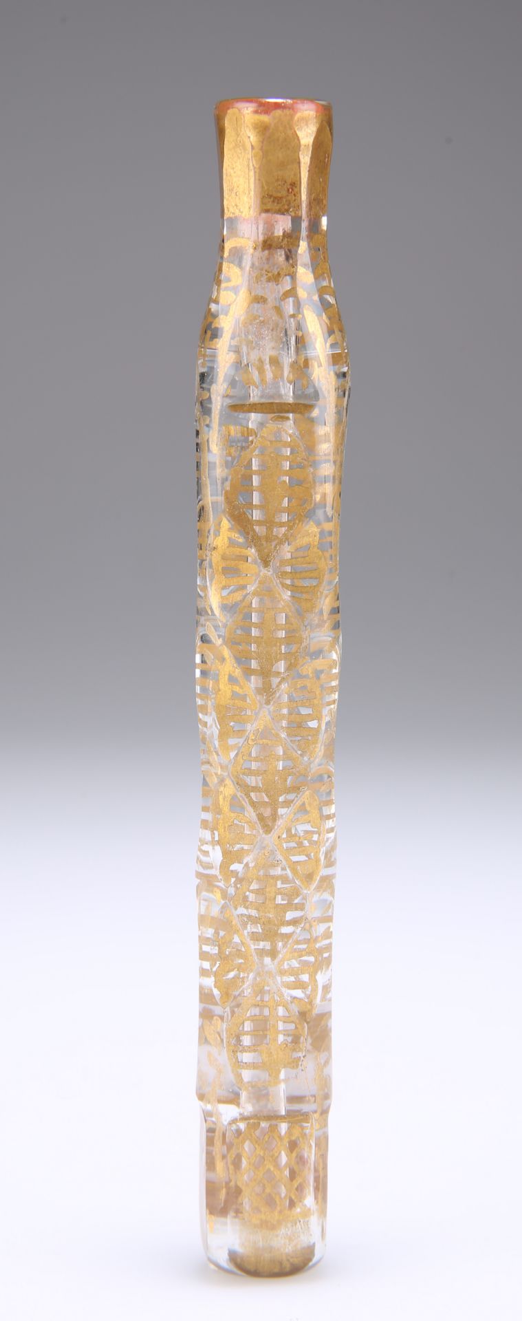 A CONTINENTAL 19TH CENTURY GILDED GLASS SCENT FLASK, of oblong section with facet cuts. 13.5cm