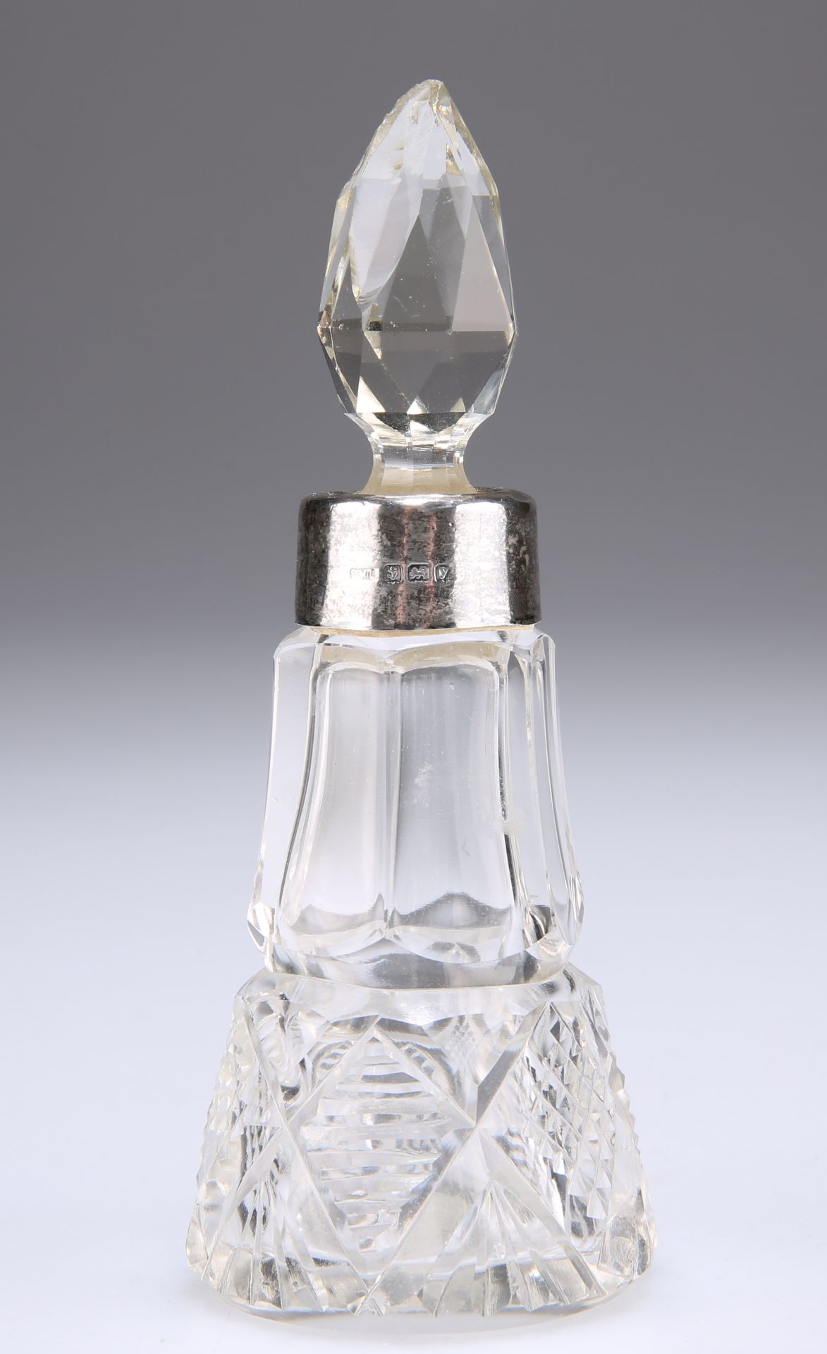 A GEORGE V SILVER-MOUNTED CUT-GLASS SCENT BOTTLE