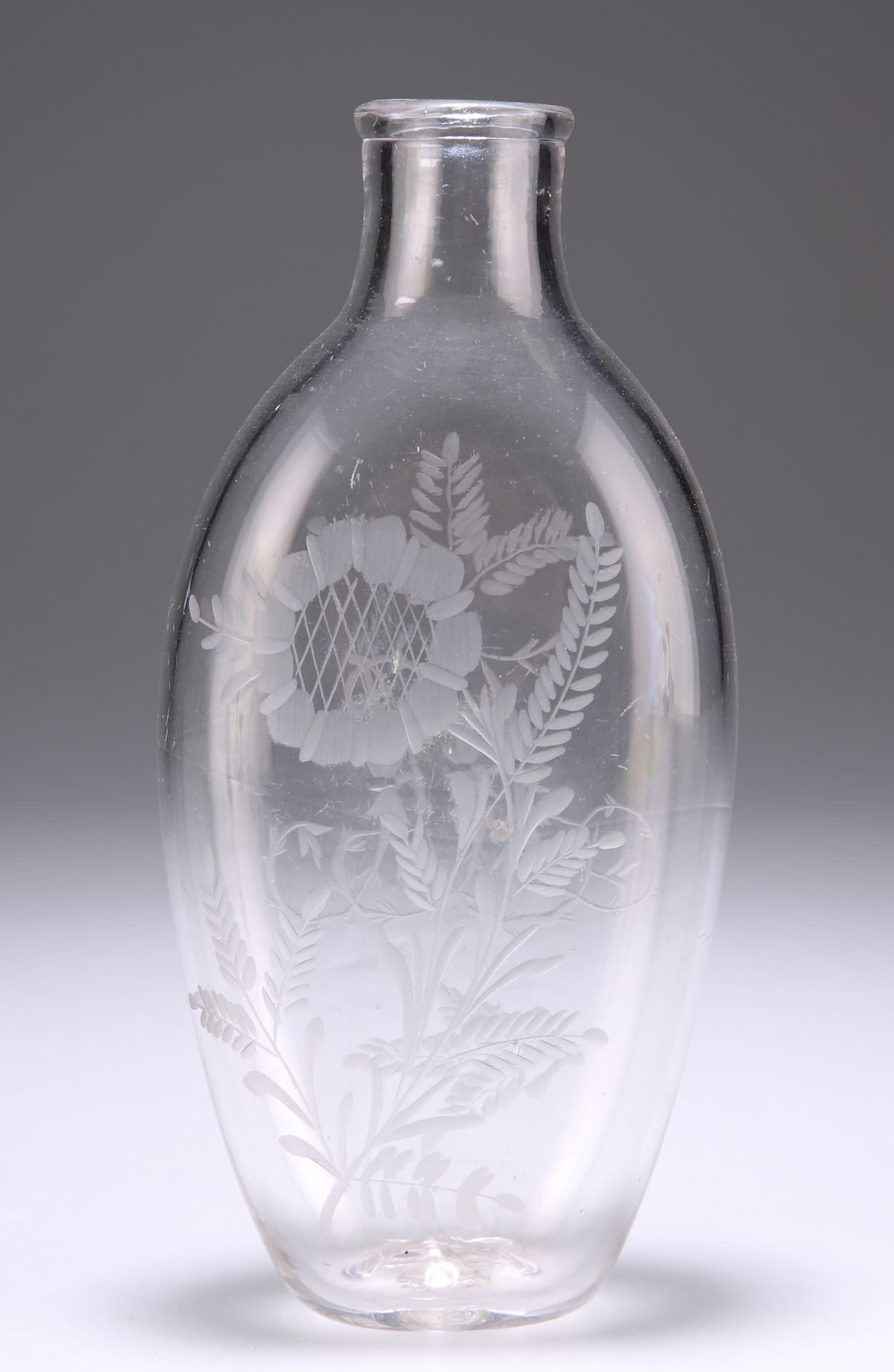 A 19TH CENTURY GLASS FLASK, ovoid, engraved with foliage to each side and to one side a monogram. - Image 2 of 2