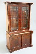 A VICTORIAN MAHOGANY BOOKCASE CABINET the upper section with a pair of astragal glazed doors flanked