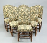 A SET OF SIX FRENCH OAK AND UPHOLSTERED DINING CHAIRS, each with upholstered back and seat, raised