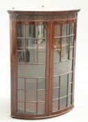 A VICTORIAN CHIPPENDALE STYLE MAHOGANY BOW FRONTED HANGING CORNER CABINET