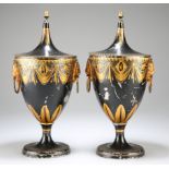 A PAIR OF GEORGIAN TOLE CHESTNUT URNS AND COVERS