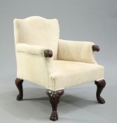 A HANDSOME CARVED AND UPHOLSTERED ARMCHAIR