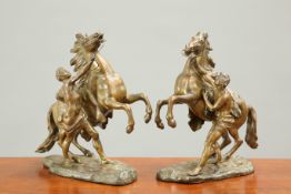 A PAIR OF 19TH CENTURY BRONZE MODELS OF MARLY HORSES