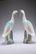 A PAIR OF CHINESE FAMILLE ROSE CRANES