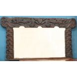 A LARGE ARTS AND CRAFTS CELTIC REVIVAL OAK OVERMANTEL MIRROR