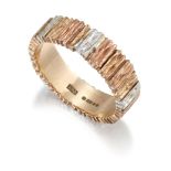A 9CT TRI-COLOURED GOLD TEXTURED BAND RING, CIRCA 1970s