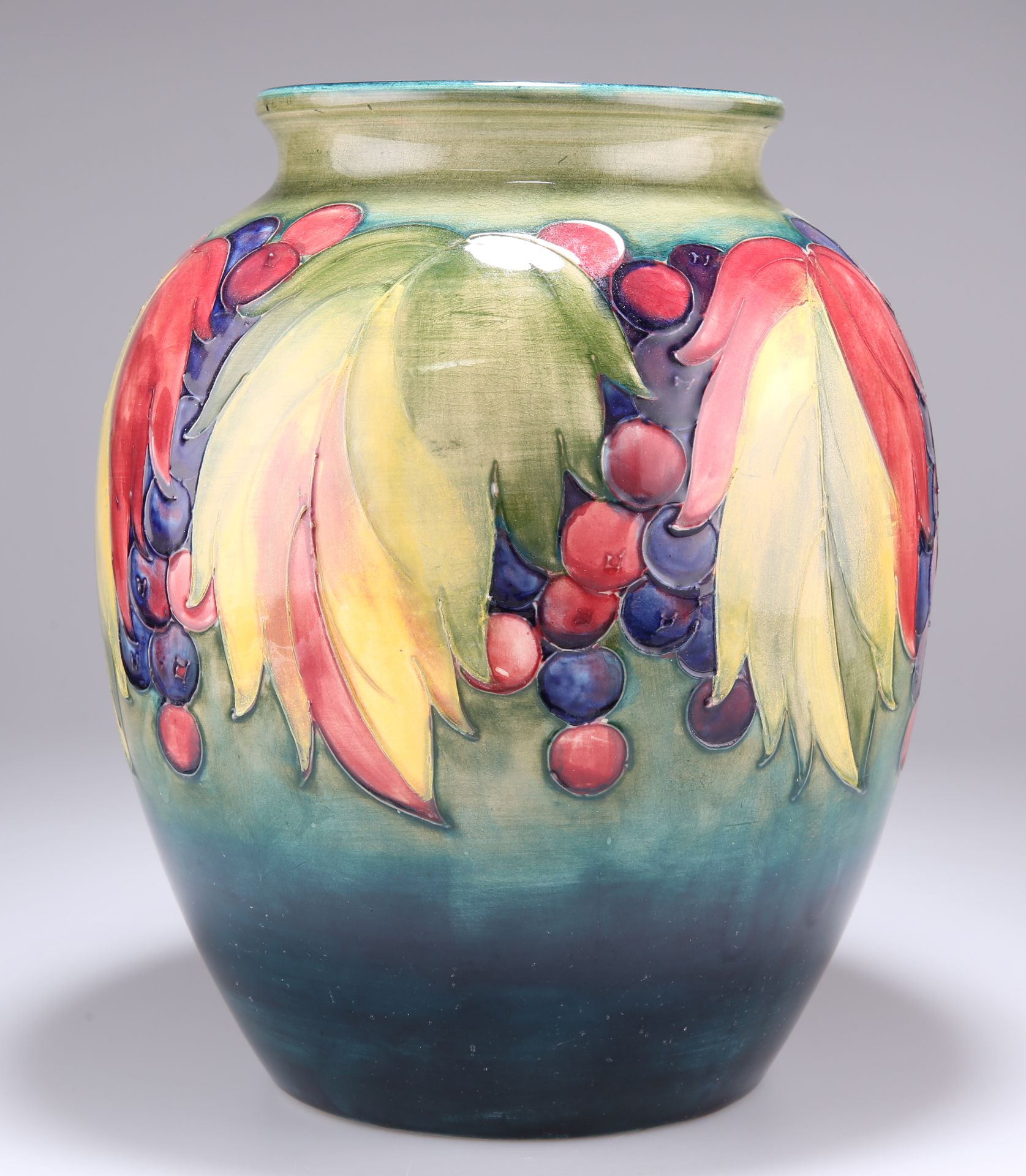 WALTER MOORCROFT, A LARGE "LEAF AND BERRY" PATTERN POTTERY VASE