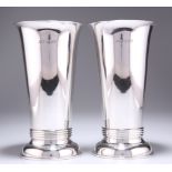 A PAIR OF ARTS AND CRAFTS SILVER VASES, by Ollivant & Botsford