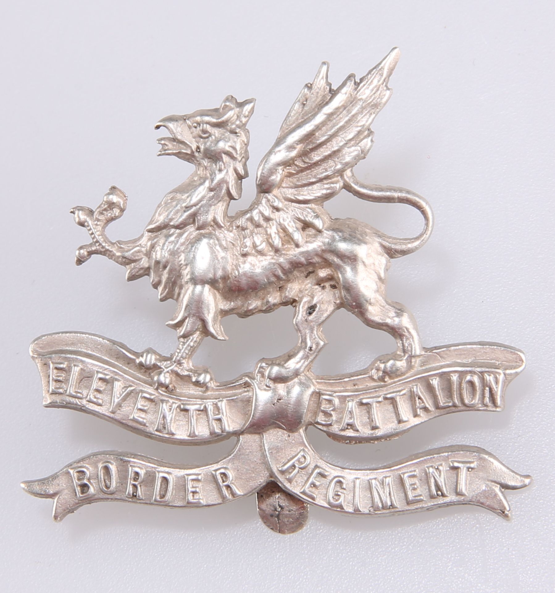 A WWI DIE STRUCK SILVER PLATE OFFICERS' CAP BADGE