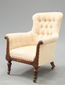 A VICTORIAN ROSEWOOD AND UPHOLSTERED ARMCHAIR OF GILLOWS TYPE